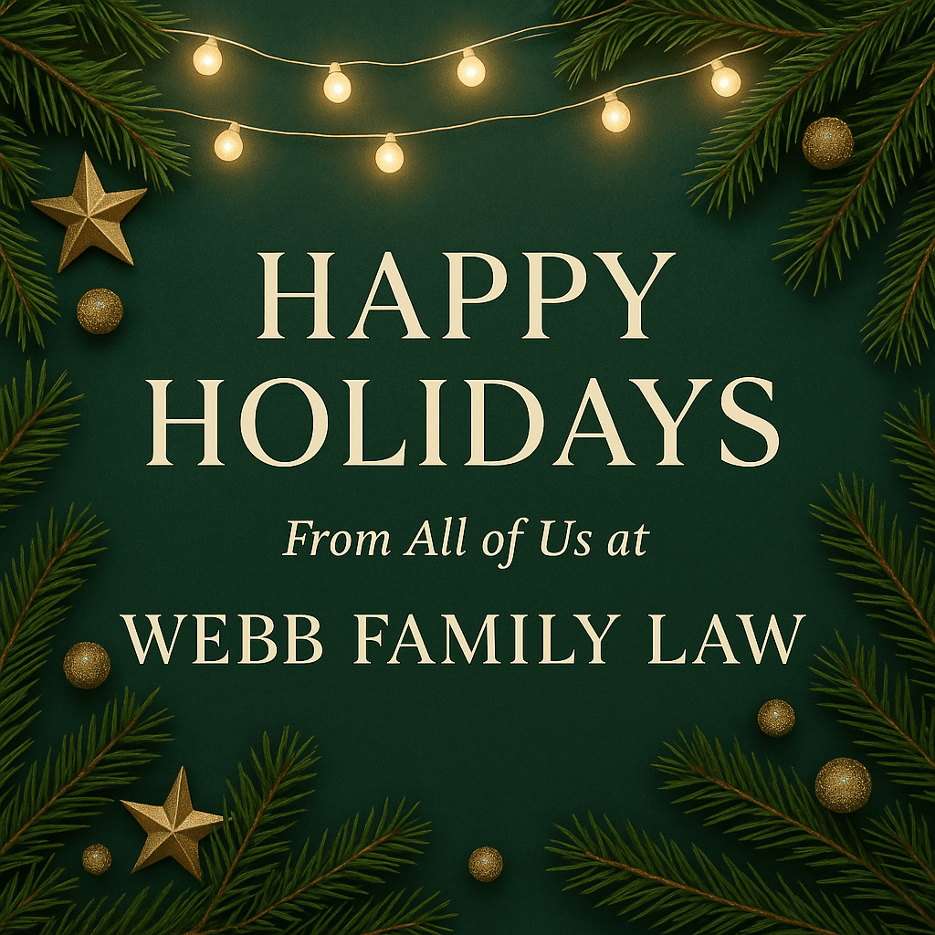 Happy Holidays from Webb Family Law with festive greenery and gold lights