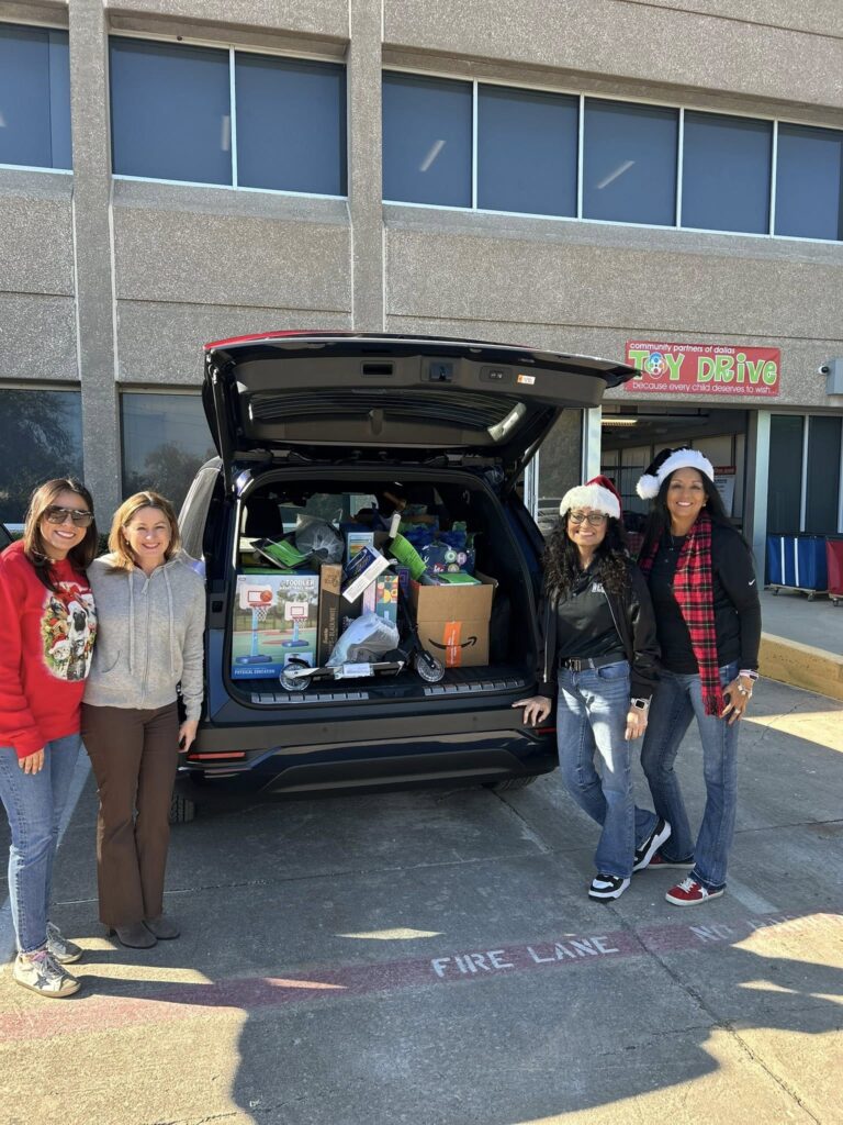 Webb Family Law staff delivering toys for Community Partners of Dallas holiday toy drive